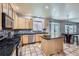 Well-lit kitchen with stainless steel appliances, granite countertops, and an island at 11321 Mesa Verde Pl, Parker, CO 80138