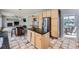 Charming kitchen features a large island with black granite countertops and stainless steel appliances at 11321 Mesa Verde Pl, Parker, CO 80138