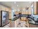 Bright kitchen featuring stainless steel appliances, granite countertops, and ample cabinet space at 11321 Mesa Verde Pl, Parker, CO 80138