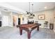 Basement area with a pool table, staircase and bar area at 13084 Deer Ridge Way, Larkspur, CO 80118
