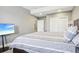 Bedroom with comfortable bedding, a tv and a view to the bedroom doorway and closet at 13084 Deer Ridge Way, Larkspur, CO 80118