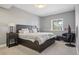 Comfortable bedroom with a large bed, neutral color palette, and a bright window at 13084 Deer Ridge Way, Larkspur, CO 80118