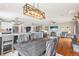 Dining area with hardwood floors and open access to the kitchen and living areas at 13084 Deer Ridge Way, Larkspur, CO 80118