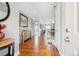 Welcoming foyer featuring hardwood floors and entry to staircase at 13084 Deer Ridge Way, Larkspur, CO 80118