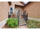 Inviting front porch with rocking chairs and decorative plants at 13084 Deer Ridge Way, Larkspur, CO 80118