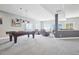Spacious game room with a pool table and comfortable seating area to enjoy the view at 13084 Deer Ridge Way, Larkspur, CO 80118