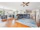 Open-concept living space with hardwood floors, a ceiling fan, and a cozy seating area with a view at 13084 Deer Ridge Way, Larkspur, CO 80118