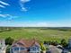 Beautiful aerial view of the neighborhood, showing a large green field and a clear blue sky at 2550 S Cutters Cir # 105, Castle Rock, CO 80108