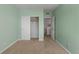 Bedroom with pale green walls, closet and doorways to other rooms at 2550 S Cutters Cir # 105, Castle Rock, CO 80108