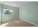 Bright bedroom with a large window and light green walls, offering a peaceful atmosphere at 2550 S Cutters Cir # 105, Castle Rock, CO 80108