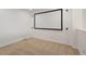 A well-lit, carpeted bonus room featuring a large movie screen for entertainment at 2550 S Cutters Cir # 105, Castle Rock, CO 80108