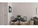Dining area with a round table, chairs, hardwood floors, and minimalist decor at 2550 S Cutters Cir # 105, Castle Rock, CO 80108
