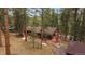 Home with a spacious deck area, ideal for entertaining and enjoying the wooded scenery at 28630 Pine Dr, Evergreen, CO 80439