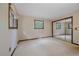 Spacious bedroom with neutral carpet, natural light from two windows, and a large closet with mirrored doors at 28630 Pine Dr, Evergreen, CO 80439
