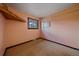 Bright bedroom with neutral carpet and a window offering natural light at 28630 Pine Dr, Evergreen, CO 80439