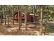 Charming multi-level home with a deck surrounded by a serene forest at 28630 Pine Dr, Evergreen, CO 80439