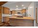 Well-lit kitchen featuring wooden cabinets, butcher block island, and stainless steel appliances at 28630 Pine Dr, Evergreen, CO 80439