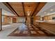 Spacious open concept living area featuring wood floors and a kitchen with wood cabinets at 28630 Pine Dr, Evergreen, CO 80439