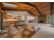 Open floor plan with kitchen, living, and dining areas featuring wood accents at 28630 Pine Dr, Evergreen, CO 80439