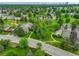 Aerial view showcasing a leafy neighborhood, green spaces, and a mix of residential homes at 7409 E Jamison Dr, Centennial, CO 80112
