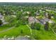 Aerial view of the neighborhood showcasing lush green landscape, mature trees, and well-maintained homes at 7409 E Jamison Dr, Centennial, CO 80112