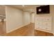 Finished basement with tv and mirrored closet providing ample storage, perfect for Gathering activities at 7409 E Jamison Dr, Centennial, CO 80112