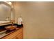 Elegant bathroom features a unique vessel sink and stylish countertop at 7409 E Jamison Dr, Centennial, CO 80112