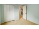 Clean and bright bedroom with closet, carpet flooring and door ready for its new owner at 7409 E Jamison Dr, Centennial, CO 80112