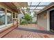 Exterior view of wooden deck with a covered ceiling, outdoor lighting, and seating area at 7409 E Jamison Dr, Centennial, CO 80112