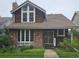 Charming two-story brick home with a well-manicured lawn and lush garden landscaping at 7409 E Jamison Dr, Centennial, CO 80112