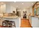 Updated kitchen features stainless steel appliances, granite countertops, and a breakfast bar at 7409 E Jamison Dr, Centennial, CO 80112