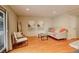 Inviting living room featuring hardwood floors, neutral walls, and comfortable seating arrangement at 7409 E Jamison Dr, Centennial, CO 80112