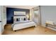 Comfortable main bedroom with a king-sized bed, built-in shelving, and soft natural light at 7409 E Jamison Dr, Centennial, CO 80112