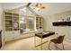 Well lit home office with windows, built-in cabinets and a cozy window bench seating at 7409 E Jamison Dr, Centennial, CO 80112