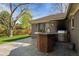 Backyard featuring a brick patio and outdoor cooking area with a grill at 4951 Sanford W Cir, Cherry Hills Village, CO 80113
