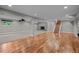 Spacious finished basement featuring a fireplace, hardwood floors, and carpet at 4951 Sanford W Cir, Cherry Hills Village, CO 80113