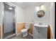 Bathroom with walk in shower and vanity with decorative mirror at 4951 Sanford W Cir, Cherry Hills Village, CO 80113