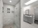 Beautiful bathroom featuring subway tile shower and a gray vanity with granite countertop at 4951 Sanford W Cir, Cherry Hills Village, CO 80113