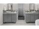 Luxurious bathroom with dual sinks, granite counters, and a separate vanity area at 4951 Sanford W Cir, Cherry Hills Village, CO 80113