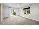 Spacious bedroom featuring neutral carpet, a ceiling fan, and access to the backyard at 4951 Sanford W Cir, Cherry Hills Village, CO 80113