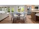 Cozy dining area adjacent to the kitchen, featuring stylish seating and abundant natural light at 4951 Sanford W Cir, Cherry Hills Village, CO 80113