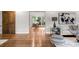 Bright living room featuring hardwood floors, a sliding glass door, and stylish decor at 4951 Sanford W Cir, Cherry Hills Village, CO 80113