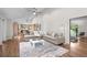 Spacious living room features hardwood floors, vaulted ceilings, and a comfortable sectional sofa, perfect for relaxation at 4951 Sanford W Cir, Cherry Hills Village, CO 80113