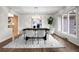 Open-concept living room with hardwood floors and view of dining area; perfect for gatherings at 4951 Sanford W Cir, Cherry Hills Village, CO 80113