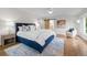 Comfortable main bedroom with wood floors and an ensuite bathroom at 4951 Sanford W Cir, Cherry Hills Village, CO 80113