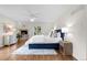 Bright main bedroom featuring a fireplace, ceiling fan, and access to the backyard at 4951 Sanford W Cir, Cherry Hills Village, CO 80113