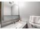 Clean bathroom with a vanity and a large mirror at 9026 E Mansfield Ave, Denver, CO 80237