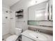 Bathroom with shower, sink, and toilet at 9026 E Mansfield Ave, Denver, CO 80237