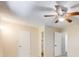 Bedroom with ceiling fan and access to bathroom at 9026 E Mansfield Ave, Denver, CO 80237