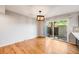 Bright dining room with hardwood floors, sliding glass door to patio at 9026 E Mansfield Ave, Denver, CO 80237